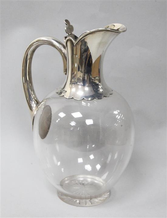 A late Victorian silver mounted glass claret jug by John Grinsell & Sons, London, 1898, 21cm.